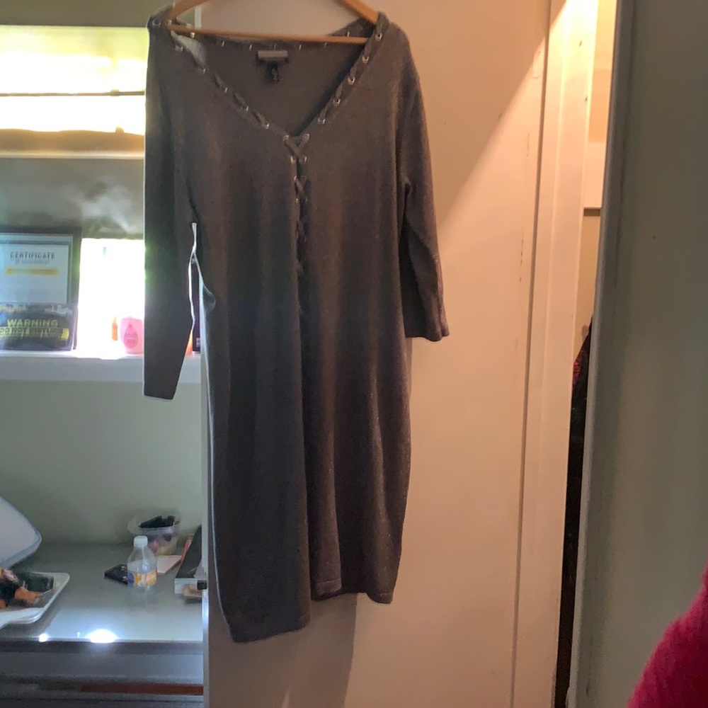This shape fitting sexy party dress has silver sparkly details in it